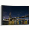 Framed canvas wall art showcasing a stunning landscape bridge design in vibrant colors, displayed from the side with a sleek black frame, perfect for home decor.