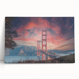 Stretched canvas wall art depicting a serene landscape featuring a bridge over a tranquil river, surrounded by lush greenery and a bright blue sky, ideal for home decor.