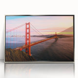 Framed acrylic wall art featuring a modern landscape design with silver accents, showcasing a bridge over a serene river, ideal for contemporary home decor.