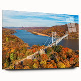 Acrylic glass wall art showcasing a serene landscape with a bridge, set against a vibrant sunset backdrop, perfect for enhancing home decor.