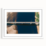 Framed landscape wall art showcasing a serene bridge scene, featuring a white mat and elegant frame, perfect for enhancing modern home decor.