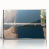 Framed acrylic wall art featuring a vibrant landscape with intricate bridges, displayed in a sleek white frame, ideal for modern home decor. The composition highlights lush greenery and serene water, adding a touch of tranquility to any space.