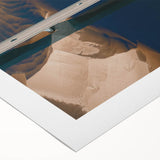 Rolled canvas artwork showcasing a serene landscape bridge scene with vibrant colors, ideal for home decor, neatly packaged in a protective tube.