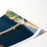 Abstract landscape wall art featuring a vibrant sunset over a bridge, printed on high-quality canvas, showcasing rich colors of orange, blue, and green, perfect for modern decor.