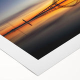 Rolled canvas art showcasing a serene landscape with a bridge over a tranquil river, featuring vibrant colors and intricate details, perfect for home decor.