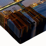 Close-up of a stretched canvas wall art piece showcasing a vibrant landscape with a bridge, featuring rich colors and detailed textures, ideal for home decor.