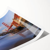 Vibrant landscape wall art print showcasing a serene bridge over a tranquil river, ideal for home decor, rolled in a protective tube for easy display.