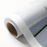 Rolled canvas artwork showcasing a vibrant landscape bridge design with intricate details, ideal for home decor, presented in a protective cardboard tube.