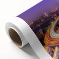 Rolled canvas artwork showcasing a serene landscape with a bridge over a tranquil river, featuring vibrant colors and intricate details, ideal for home decor.