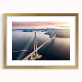 Elegant gold-framed wall art showcasing a stunning landscape bridge design, complete with a mat, ideal for enhancing home decor and creating a serene atmosphere.