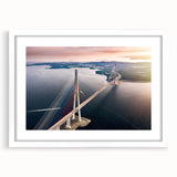 Framed wall art collection showcasing a serene landscape with a bridge, featuring a white mat and sleek frame, ideal for home decor and interior design.