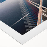 Rolled canvas featuring a beautiful landscape bridge design with vibrant colors, perfect for home decor. Packaged securely in a protective cardboard tube.