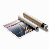 Rolled print showcasing a vibrant landscape design with a bridge set against a serene backdrop, ideal for home décor or office spaces, packaged securely in a tube.