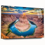 Side view of a modern acrylic glass wall art piece showcasing vibrant canyon landscapes, elegantly displayed with decorative pins on a neutral background.