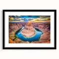 Framed landscape wall art showcasing a vibrant canyon design in rich colors, featuring a sleek black frame and mat, perfect for enhancing home decor.