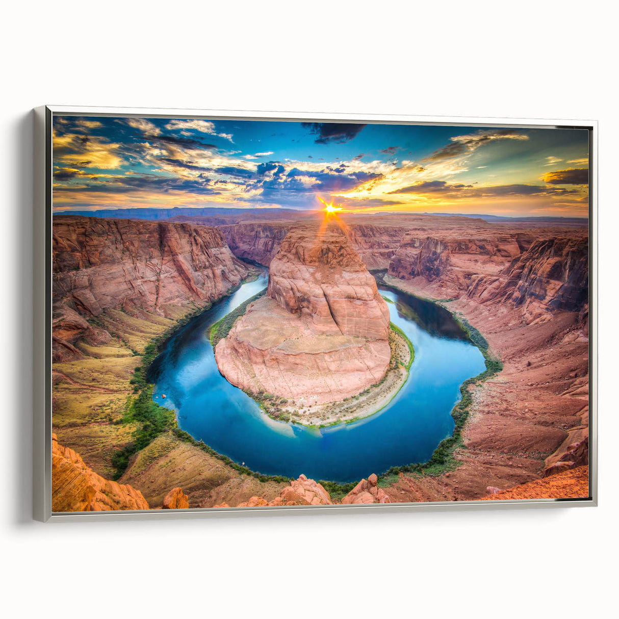 Framed canvas wall art showcasing a stunning canyon landscape design in vibrant colors, featuring a sleek silver frame. Ideal for modern home decor.