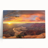 Stretched canvas wall art featuring a vibrant canyon landscape with warm earth tones, elegantly leaning against a neutral wall, perfect for home decor.
