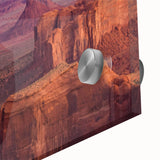 Close-up of a vibrant acrylic glass wall art piece showcasing a breathtaking canyon landscape, highlighting rich colors and intricate textures, perfect for home decor.