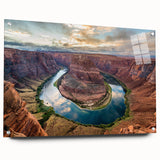 Acrylic glass wall art piece showcasing a vibrant canyon landscape design, featuring vivid colors and intricate details, displayed from a side view with mounting pins visible. Perfect for enhancing home decor with a natural touch.