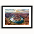 Black-framed landscape wall art featuring a canyon design with a white mat, showcasing vibrant colors and intricate details, ideal for home decor.