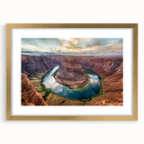 Framed wall art depicting a stunning canyon landscape with vibrant colors and intricate details, featuring a gold mat and sleek frame, perfect for home decor.