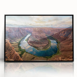 Framed acrylic wall art showcasing a vibrant canyon landscape design in rich earthy tones, featuring a sleek black frame and modern aesthetic for home decor.