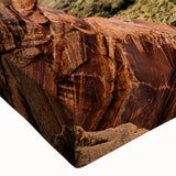 Close-up of stretched canvas wall art showcasing vibrant canyon landscapes, featuring rich earth tones and intricate textures, perfect for home decor enhancement.