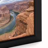 Framed canvas wall art showcasing a vibrant canyon landscape with rich earthy tones and intricate textures, perfect for adding depth to modern home decor.