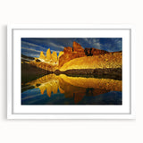 Framed wall art of a vibrant canyon landscape, showcasing rich colors and intricate details, set against a clean white mat, perfect for home decor enhancement.