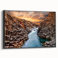 Framed canvas wall art showcasing a stunning canyon landscape design in vibrant colors, featuring a sleek black frame and side view for elegant display.