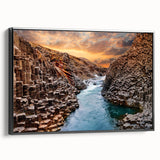 Framed canvas wall art showcasing a stunning canyon landscape design in vibrant colors, featuring a sleek black frame and side view for elegant display.