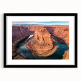 Framed wall art showcasing a stunning canyon landscape, featuring earthy tones and intricate details, ideal for home decor. Black frame enhances the artwork.