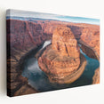 Stretched canvas wall art showcasing a vibrant canyon landscape with rich earthy tones, perfect for adding a natural touch to home decor.