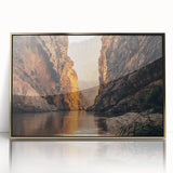 Framed acrylic wall art featuring a stunning canyon landscape design with gold accents, showcasing vibrant colors and intricate details in a modern setting. Perfect for enhancing home decor with a touch of nature-inspired elegance.