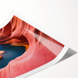 Stunning rolled print of a vibrant canyon landscape, showcasing rich hues of orange and blue, perfect for modern home decor or art collection.