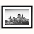 Framed wall art showcasing a picturesque castle landscape design, featuring a sleek black frame and white mat, perfect for enhancing home decor aesthetics.