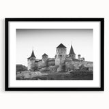Framed wall art showcasing a picturesque castle landscape design, featuring a sleek black frame and white mat, perfect for enhancing home decor aesthetics.