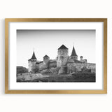 Framed gold wall art displaying a picturesque landscape with a castle, featuring a matting design that enhances its elegance and charm for home decor.