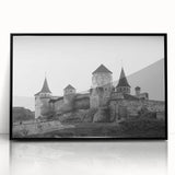 Framed wall art showcasing a stunning landscape of a castle, featuring intricate details and vibrant colors, displayed in a sleek black frame, perfect for home decor.