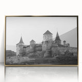 Framed wall art featuring a scenic landscape of a majestic castle, highlighted with gold accents and a sleek acrylic front, perfect for home decor.