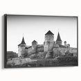 Framed canvas wall art showcasing a stunning castle landscape design, featuring rich colors and intricate details, presented in a sleek black frame, ideal for home decor.