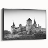 Framed canvas wall art showcasing a stunning castle landscape design, featuring rich colors and intricate details, presented in a sleek black frame, ideal for home decor.