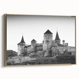 Framed canvas wall art showcasing a landscape of a majestic castle surrounded by lush greenery, highlighted by a gold frame for an elegant touch. Ideal for home decor.