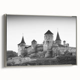Framed canvas wall art showcasing a picturesque landscape featuring a majestic castle, presented in a sleek silver frame, ideal for enhancing home décor.
