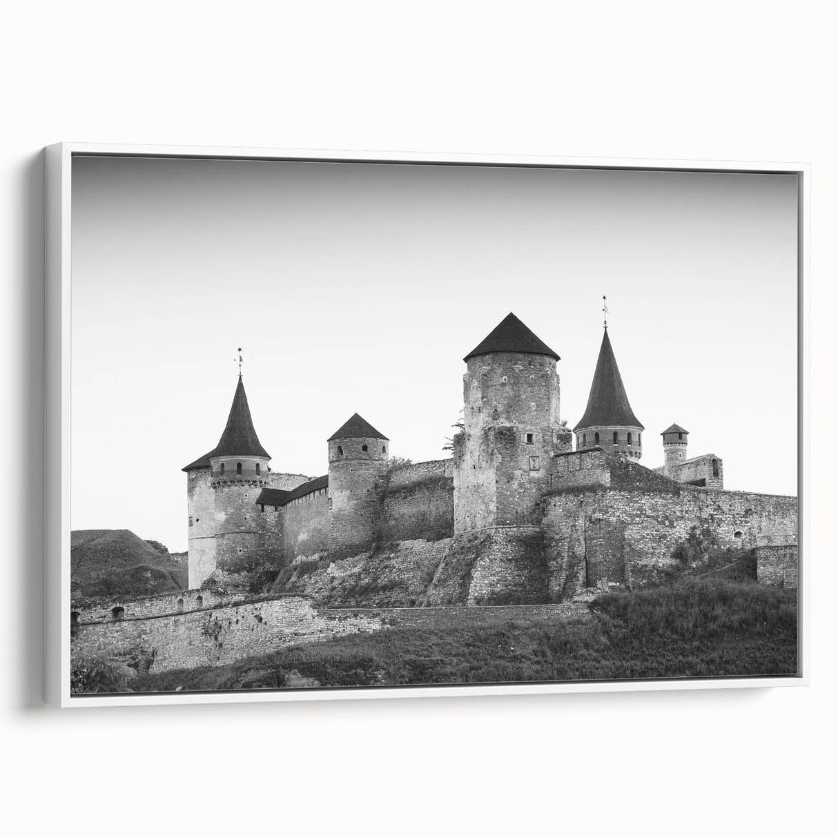 Framed canvas wall art showcasing a picturesque landscape featuring a majestic castle against a serene sky, ideal for home decor and interior design enthusiasts.
