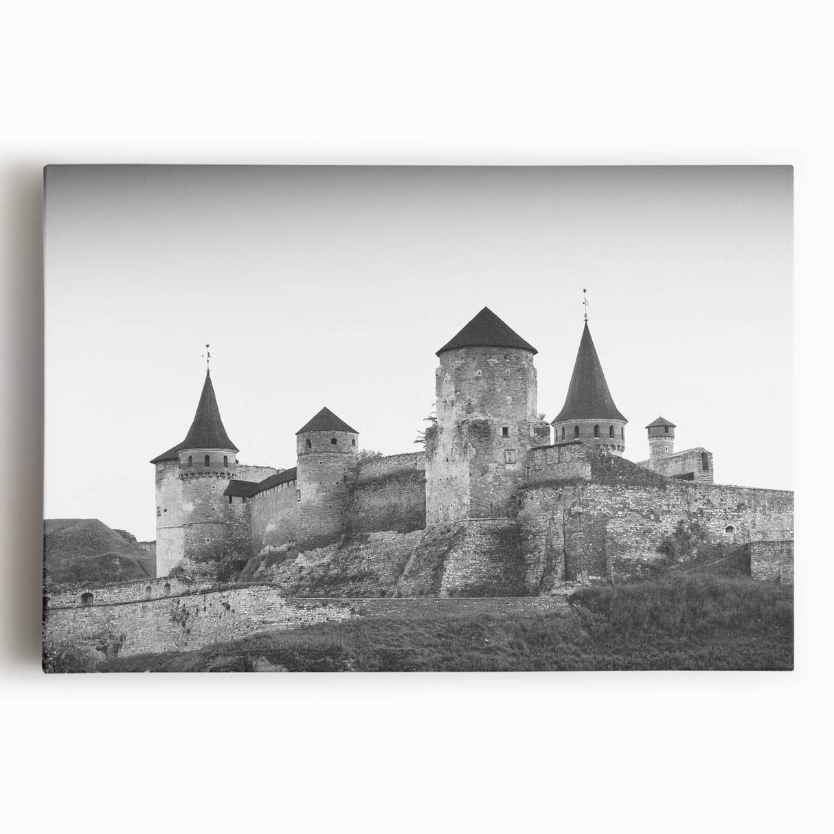Stretched canvas wall art showcasing a stunning landscape with a medieval castle, vibrant colors, and intricate details, perfect for home decor enthusiasts.