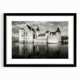 Framed wall art collection showcasing a stunning landscape with a castle design, featuring a sleek black frame and white mat, ideal for home decor enhancement.