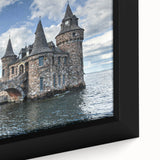 Close-up of a framed canvas print showcasing a stunning landscape with a castle, featuring vibrant colors and intricate details, perfect for home decor.