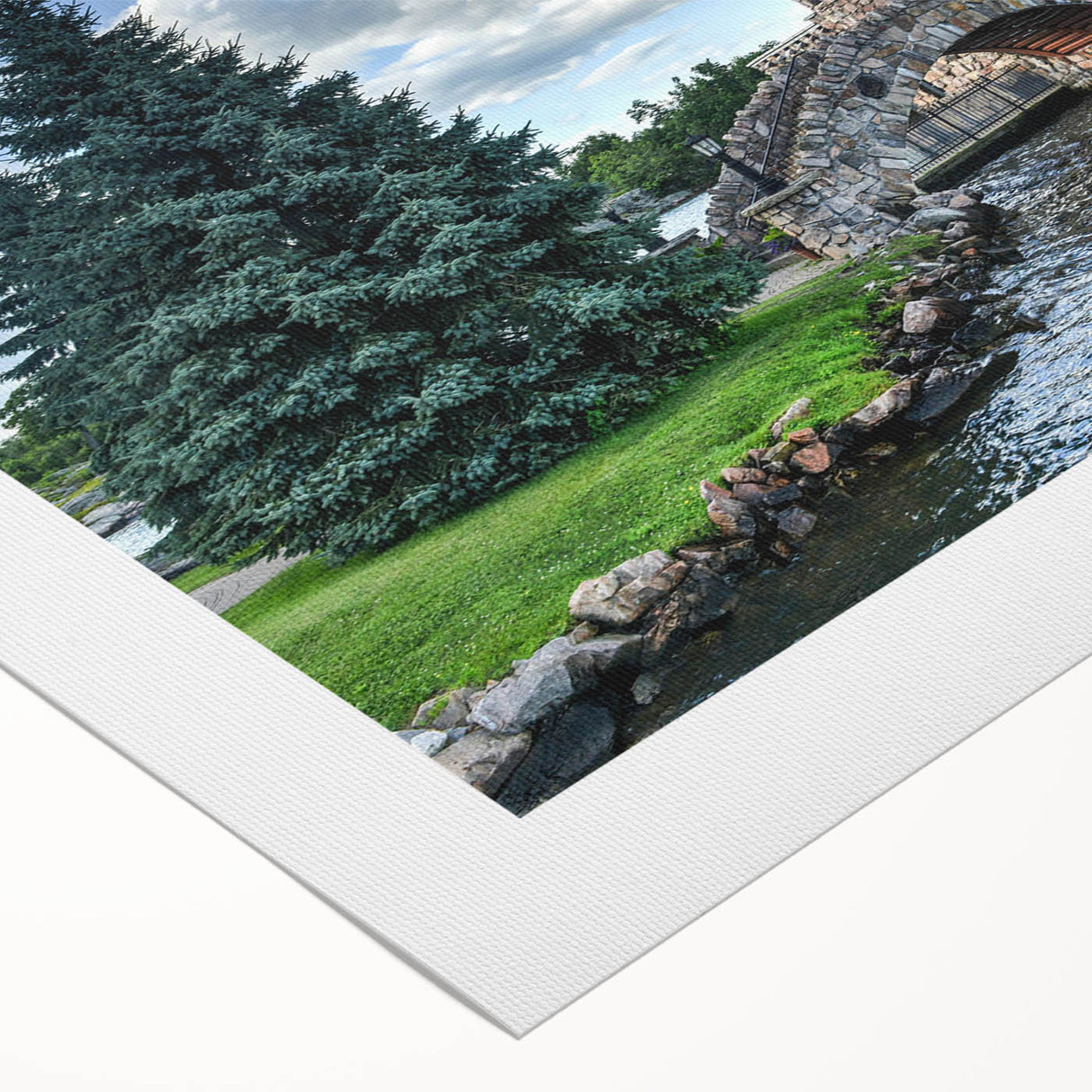 Rolled canvas art showcasing a vibrant landscape of a majestic castle surrounded by lush greenery, ideal for home decor enthusiasts seeking elegant wall art.