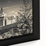 Close-up of a framed canvas artwork showcasing a detailed landscape of a majestic castle surrounded by lush greenery, highlighting intricate design elements and vibrant colors, perfect for home decor enthusiasts.